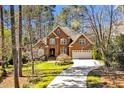 Beautiful brick home with well-maintained lawn and a curved driveway at 81517 Alexander, Chapel Hill, NC 27517