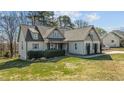 Beautiful exterior view of home featuring manicured landscaping and lush green lawn at 1046 Lawrence Rd, Wake Forest, NC 27587