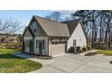 Spacious two-car garage with ample driveway space, enhanced by tasteful landscaping at 1046 Lawrence Rd, Wake Forest, NC 27587