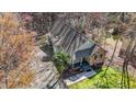 An elevated view displaying the home's private lot, back deck, and inviting exterior finishes at 113 Pony Dr, Louisburg, NC 27549