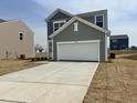 New construction home with a two-car garage and a long concrete driveway at 1149 Centerview Drive, Nashville, NC 27856