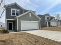 New construction home with a two-car garage and gray siding at 1149 Centerview Drive, Nashville, NC 27856