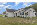 Attractive single story home with manicured landscaping and dark shutters at 11771 Raleigh Rd, Four Oaks, NC 27524