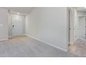 Bright foyer featuring neutral carpet, clean white walls, and a glimpse into adjacent rooms at 11771 Raleigh Rd, Four Oaks, NC 27524