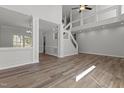Bright living room featuring hardwood floors, high ceilings, and an open-concept design at 2613 Coxindale Dr, Raleigh, NC 27615