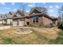 Charming single-Gathering home with a brick exterior, well-maintained lawn, and a two-car garage at 310 Macallan, Burlington, NC 27215