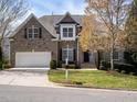 Beautiful two-story brick home with a manicured lawn and a welcoming front yard at 314 Montelena Pl, Cary, NC 27513