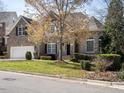 Charming two-story brick home with mature landscaping and a well-maintained lawn at 314 Montelena Pl, Cary, NC 27513