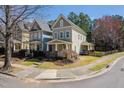 Inviting two-story home featuring a well-kept lawn and sidewalk at 4443 Crystal Breeze St, Raleigh, NC 27614