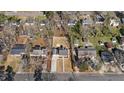 Aerial view of a single-Gathering home with spacious yard surrounded by neighboring properties at 518 W Chisholm St, Sanford, NC 27330