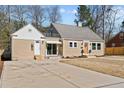Inviting single Gathering home features a spacious driveway, a charming front entrance, and a well-maintained lawn at 518 W Chisholm St, Sanford, NC 27330