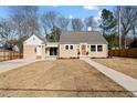 Charming single-story home with manicured lawn and inviting front porch at 518 W Chisholm St, Sanford, NC 27330