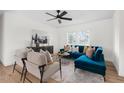 Bright living room featuring hardwood floors, modern furnishings, and ample natural light at 546 Hickory Ln, Burlington, NC 27217