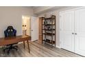 Cozy room with vinyl floors, filled with natural light from the open doorway to the bathroom at 730 Firebrick Drive Dr, Cary, NC 27519