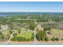 Scenic aerial shot showcases the property, lush greenery, and tranquil surrounding area at 79 John Horton Rd, Apex, NC 27502