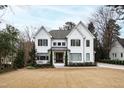 Well-maintained lawn and landscaping complement this home's exterior, enhancing its outdoor charm at 909 Lake Boone Trl, Raleigh, NC 27607