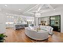 Open-concept living space with a gourmet kitchen, dining area, cozy seating, and modern finishes at 909 Lake Boone Trl, Raleigh, NC 27607