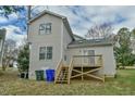 Exterior view featuring a cozy deck area, perfect for outdoor relaxation and entertainment at 110 Sudbury Ln, Chapel Hill, NC 27516