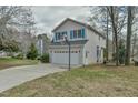 Spacious two-car garage with a basketball hoop, offering ample parking and recreation space at 110 Sudbury Ln, Chapel Hill, NC 27516