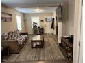 Inviting living room featuring wood-look flooring and ample natural light at 113 Warren Ave, Oxford, NC 27565