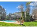 Backyard with a swimming pool and deck area perfect for outdoor entertaining and relaxation at 12504 Ribbongrass Ct, Raleigh, NC 27614