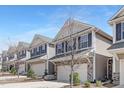 Attractive street view of newly constructed townhomes with neutral siding and well-maintained landscaping at 131 Explorer Dr # 257, Morrisville, NC 27560