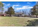 A wide shot showcases the home and surrounding property and its exterior features at 1384 Sims Bridge Rd, Kittrell, NC 27544