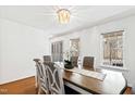 Bright and airy dining room with a decorative chandelier and natural light, perfect for gatherings at 1500 Allen Ln, Hillsborough, NC 27278