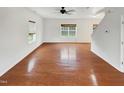 Open concept living room featuring hardwood floors and lots of natural light at 1501 Copper Cir, Mebane, NC 27302