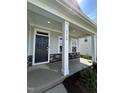 Inviting front porch with craftsman-style columns and stone accents, creating a welcoming entrance at 1560 Bright Coral Trl, Wendell, NC 27591