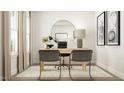 Modern home office with round mirror, wood desk, and sleek furnishings at 1560 Bright Coral Trl, Wendell, NC 27591