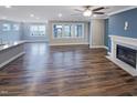 Spacious living room with fireplace and large windows for natural light at 157 Auburn Village Blvd, Raleigh, NC 27610