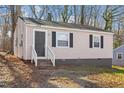 Charming home featuring a quaint front porch and symmetrical window placements at 158 Torain St, Hillsborough, NC 27278