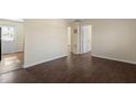 Spacious room with hardwood floors and a white door, ready for your personal touch at 158 Torain St, Hillsborough, NC 27278