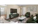 Comfortable living room with elegant decor, plush rug, and a modern entertainment center at 158 Torain St, Hillsborough, NC 27278