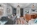 Bright and airy living room featuring hardwood floors, modern furniture, and an open floor plan at 202 Duncan St, Raleigh, NC 27608