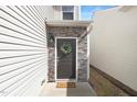 Inviting front entrance featuring a decorative wreath and a 'welcome' mat at 211 Explorer Dr # 263, Morrisville, NC 27560
