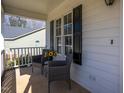 Cozy front porch featuring comfortable seating, ideal for relaxing and enjoying the outdoors at 213 Yellow Poplar Ave, Wake Forest, NC 27587