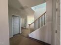 Entryway featuring staircase with black metal railings and light-colored walls at 247 Meadowbark Bnd # 29, Garner, NC 27529