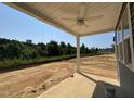 Covered back patio with a ceiling fan and a view of the backyard at 247 Meadowbark Bnd # 29, Garner, NC 27529