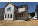Exterior view of a two-story home under construction with visible windows and covered porch area at 251 Meadowbark Bnd # 30, Garner, NC 27529