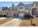 Attractive townhome with brick accents, a single car garage and well-maintained landscaping at 2822 Casona Way, Raleigh, NC 27616