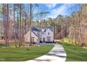 Charming two-story home with a curved driveway and a beautiful, expansive front yard at 298 Bonterra Way, Chapel Hill, NC 27516