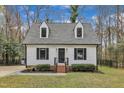 Beautifully maintained two-story home with black shutters and mature landscaping at 305 Dickens Rd, Fuquay Varina, NC 27526