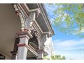 Low angle shot highlighting the decorative trim and structural elements of the porch at 321 E Lane St, Raleigh, NC 27601