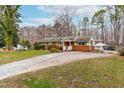 Beautiful single-Gathering home featuring a spacious driveway, a lush lawn, and mature trees adding to the landscape at 3617 Cranston Rd, Garner, NC 27529