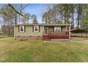 Charming home with a inviting front porch and brick foundation at 402 Abbott Dr, Sanford, NC 27330