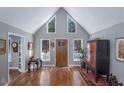 Bright foyer with soaring ceilings and hardwood floors creates a welcoming entrance at 9501 Coachway, Chapel Hill, NC 27516