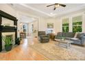 Cozy living room with fireplace, plush seating, and open floor plan at 102 Whitaker St, Franklinton, NC 27525