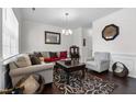 Inviting living room featuring hardwood floors, neutral walls, and comfortable seating arrangement at 1055 Kerr St, Burlington, NC 27215